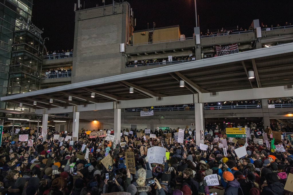 NEW YORK, NY - JANUARY 28: Protestors rally during a demonstration against the Muslim immigration ban at John F. Kennedy International Airport on January 28, 2017 in New York City. President Trump signed an executive order to suspend refugee arrivals and people with valid visa from Iran, Iraq, Libya, Somalia, Sudan, Syria and Yemen. (Photo by Maite H. Mateo/Corbis via Getty Images)