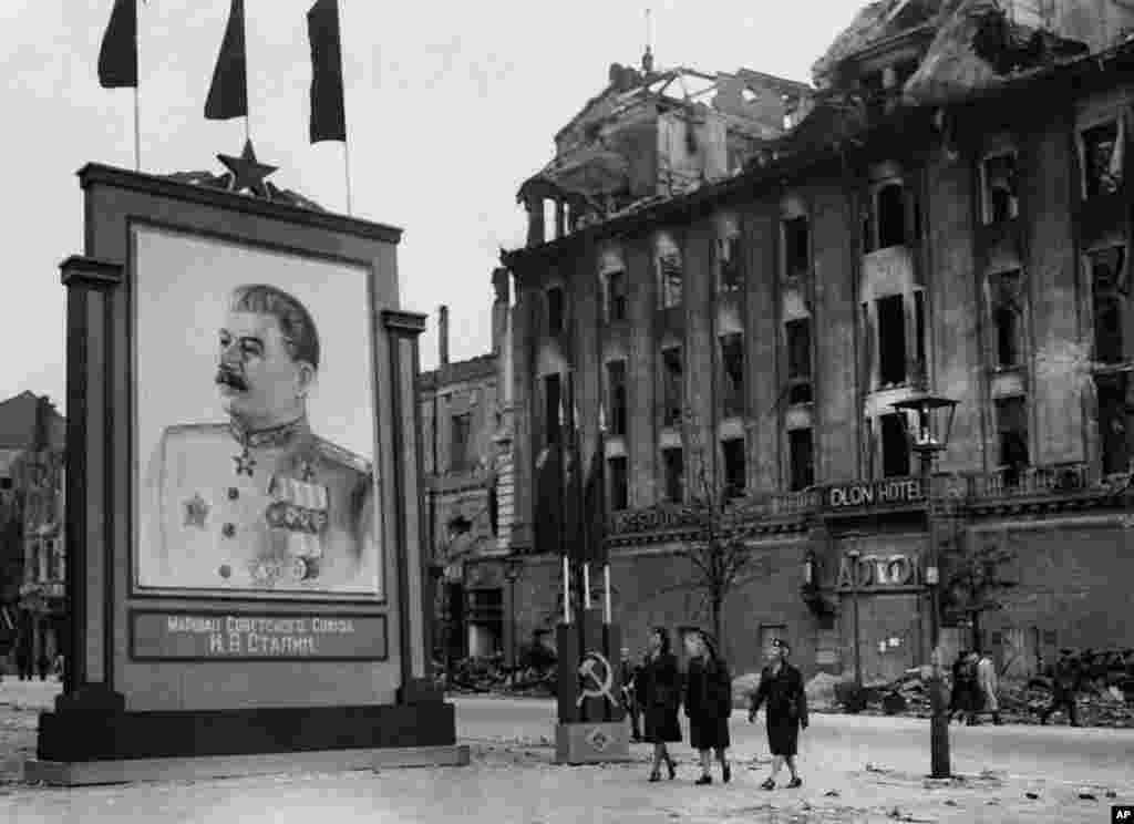 A portrait of Soviet leader Josef Stalin hangs in central Berlin in the summer of 1945. &nbsp;