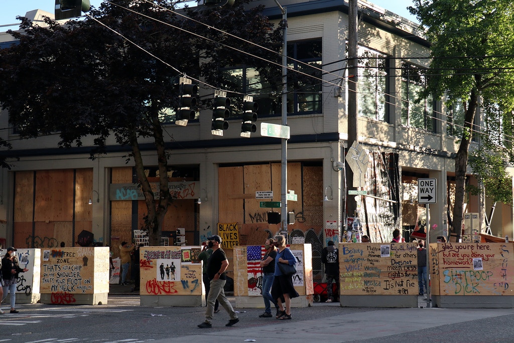 SEATTLE, WASHINGTON, UNITED STATES - 2020/06/18: Seattle's abandoned East Precinct police station is seen surrounded by barricades in the so-called Capitol Hill Autonomous Zone. An area in Seattle's Capitol Hill neighbourhood has become known variously as the Capitol Hill Occupied Protest or Capitol Hill Autonomous Zone since Mayor Jenny Durkan ordered the city's East Precinct police station to be evacuated and surrendered to protesters earlier this month. (Photo by Toby Scott/SOPA Images/LightRocket via Getty Images)