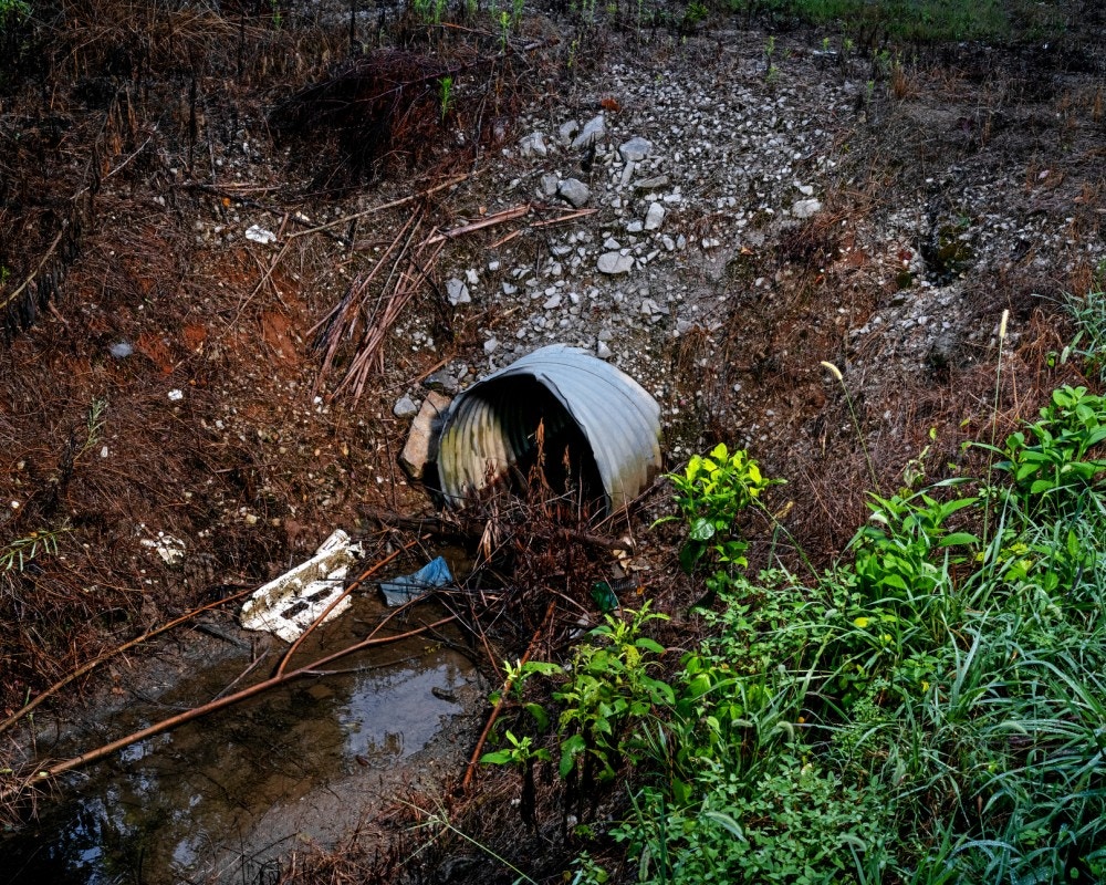 DECATUR, AL - August 20, 2020: A drainage ditch filled with trash  at the former Mud Tavern Landfill in DecaturCREDIT: Johnathon Kelso for The Intercept.