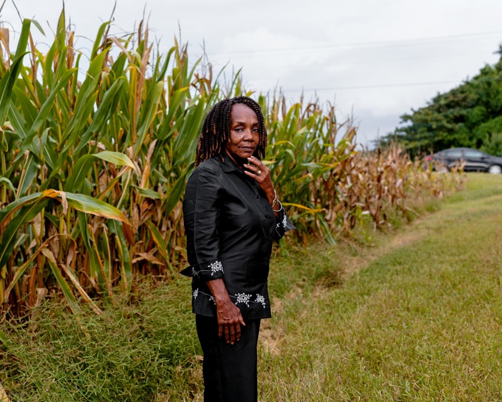 COURTLAND, AL - August 19, 2020: Brenda Hampton stands outside a corn field near her house in Courtlandl CREDIT: Johnathon Kelso for The Intercept.