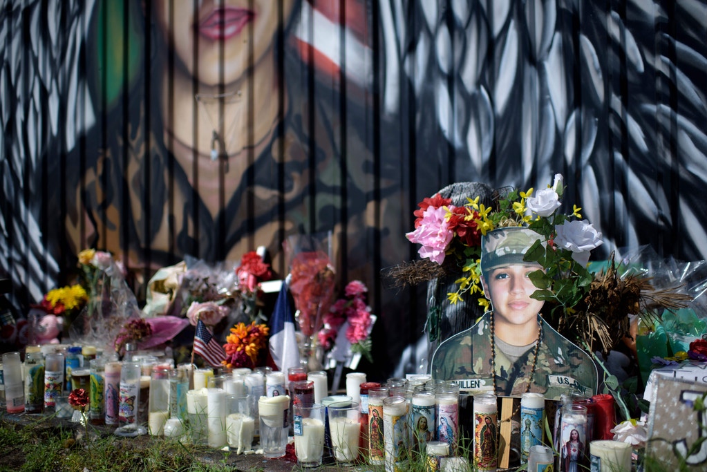 Candles and flowers decorate a makeshift memorial for US Army Specialist Vanessa Guillen at Power House Gym on August 14, 2020, in Houston, Texas.