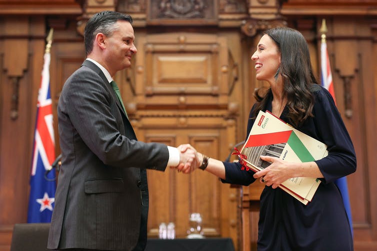 man and woman shaking hands