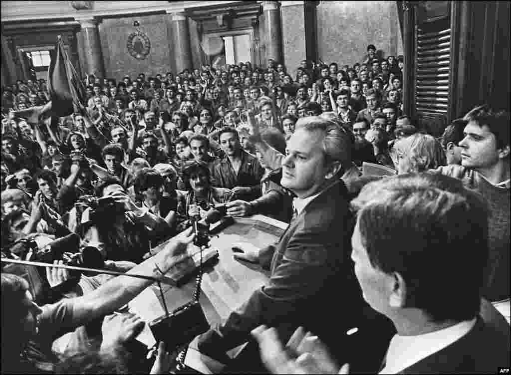 Serbian communist leader Slobodan Milosevic addresses workers inside Belgrade&rsquo;s parliament in 1988. In 1987, with ethnic tensions heating up amid economic turmoil, Milosevic openly sided with nationalist Serbs in Kosovo complaining of persecution by the majority ethnic Albanians. Many saw Milosevic&rsquo;s decision to bring historic ethnic grievances into Yugoslav politics as the breaking of a taboo. Kosovo was a dangerously sensitive region partly due to its history of interethnic clashes. It was the beginning of the end for Yugoslavia. &nbsp;