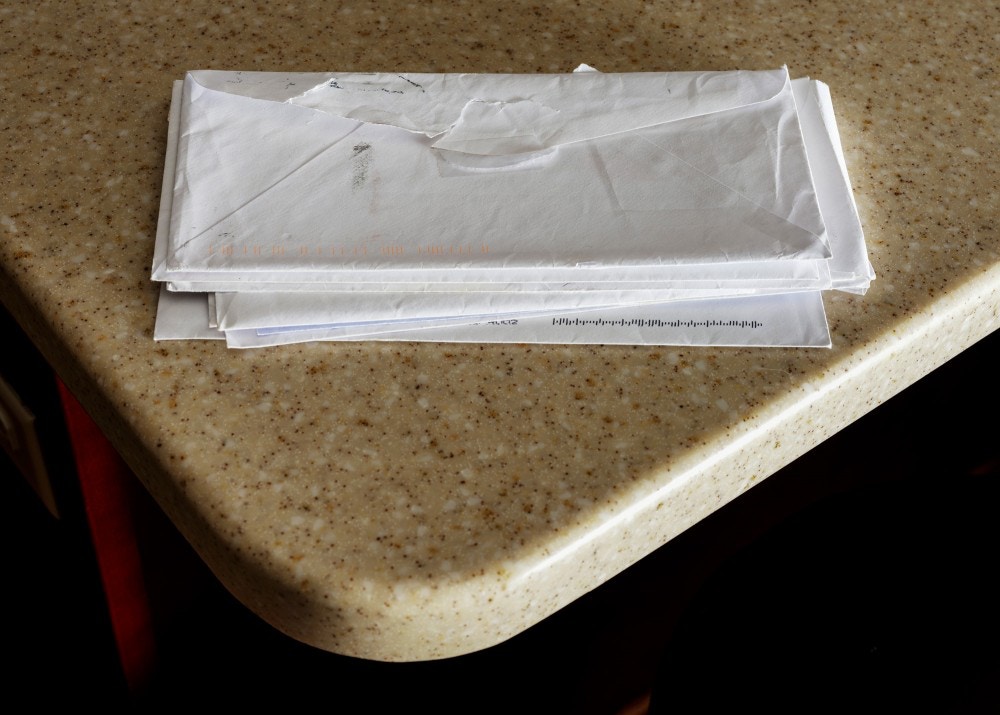 Envelopes containing letters sent to Michelle Durden by her son Cameron Davis from prison in Texas sits on the counter in Jacksonville, North Carolina, on November 16, 2020.