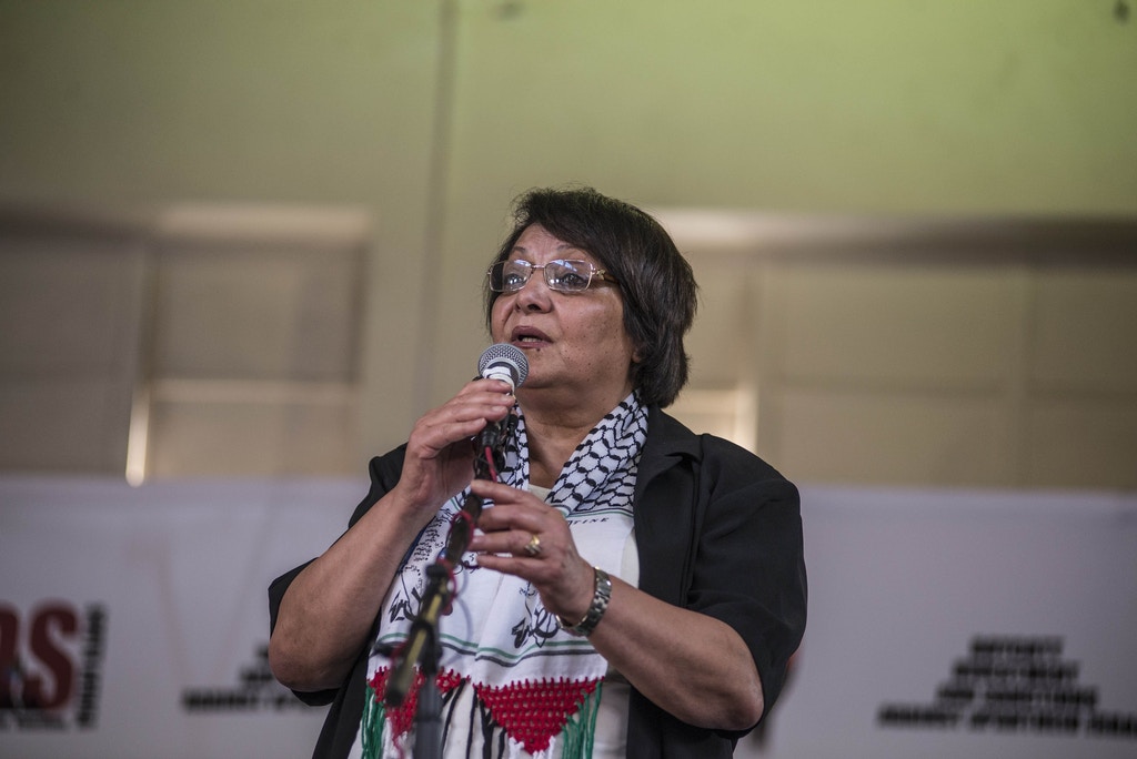 Palestinian activist Leila Khaled addresses the crowd at the DOCC Hall in Orlando East, Soweto, South Africa on February 15, 2015.