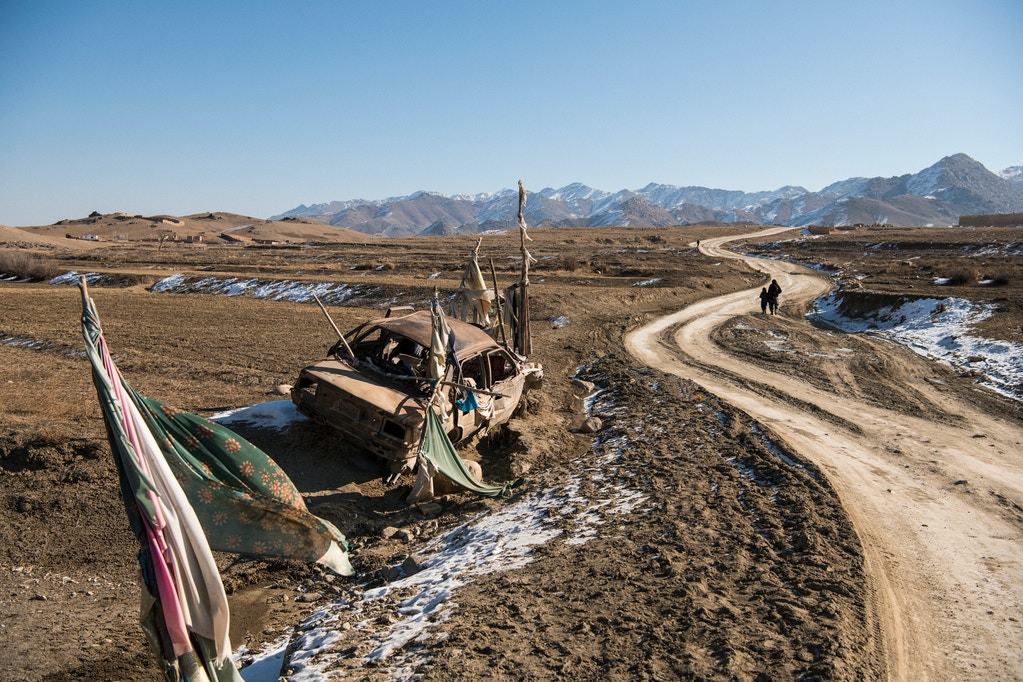 The remains of a car struck by a missile fired from what witnesses said was an American attack helicopter one night in October 2018 rusts near a road in Sebak in Wardak’s Chak District.