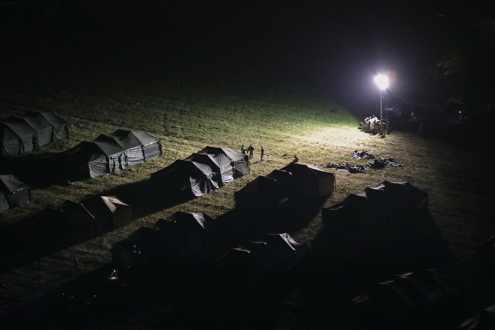 DONNA, TX - NOVEMBER 06:  U.S. Army soldiers set up camp at the international port of entry at the U.S.-Mexico border on November 6, 2018 in Donna, Texas. Army soldiers, as part of "Operation Faithful Patriot" set up razor wire around the area in recent days while preparing for the possible arrival of the migrant caravan in upcoming weeks.  (Photo by John Moore/Getty Images)