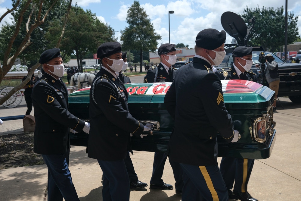 HOUSTON, TX - AUGUST 14: Military personnel carry the casket of murdered U.S. Army Private First Class Vanessa Guillen to Cesar Chavez High School for her memorial service on August 14, 2020 in Houston, Texas. Guillen, a 20-year-old U.S. Army Specialist, was found dead on June 30 after she had been reportedly missing since April 22. Guillen was allegedly killed by fellow soldier Aaron David Robinson inside the Fort Hood military base.  (Photo by Go Nakamura/Getty Images)