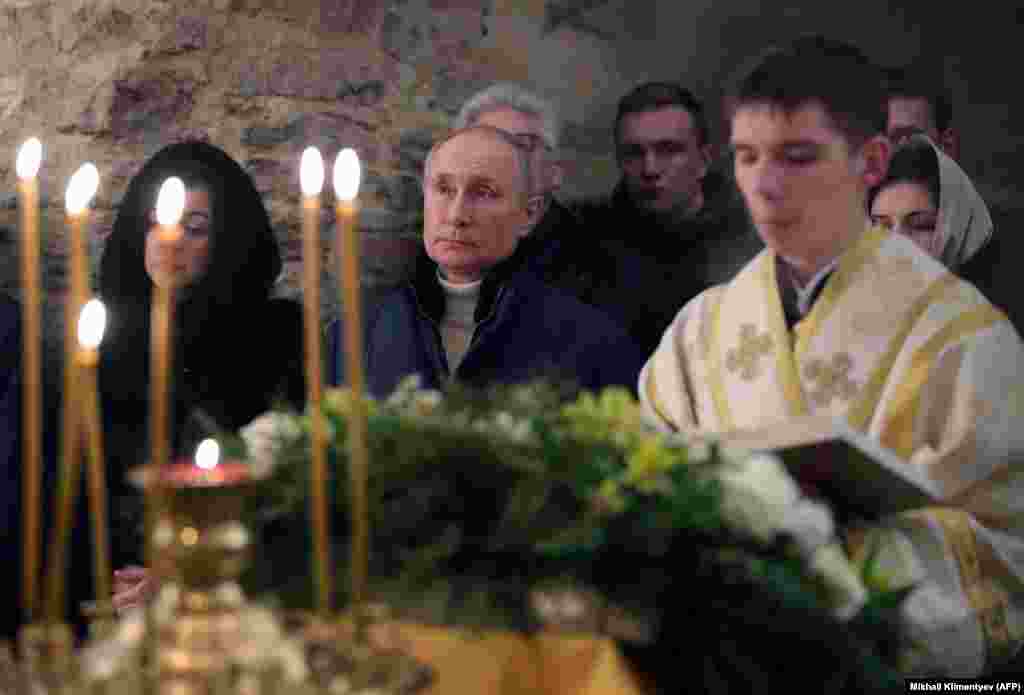 Russian President Vladimir Putin attends Orthodox Christmas mass at a small, 13th-century church near Veliky Novgorod.&nbsp;