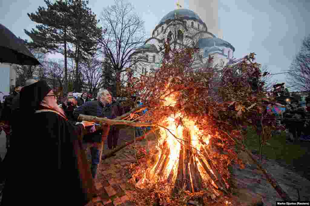 Christians burn oak branches in front of St. Sava Cathedral in Belgrade on January 6. The tradition of burning oak is believed to predate Christianity but is now a central part of Christmas celebrations in much of the Balkans.&nbsp;&nbsp;