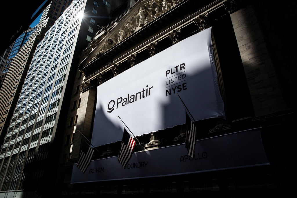 A banner displays Palantir Technologies Inc. signage during the company's initial public offering (IPO) in front of the New York Stock Exchange (NYSE) in New York, U.S., on Wednesday, Sept. 30, 2020. Shares of Palantir Technologies, a data mining company co-founded by technology billionaire Peter Thiel, opened trading today on the New York Stock Exchange at $10 after the company sold shares to investors in a direct offering. Photographer: Michael Nagle/Bloomberg via Getty Images