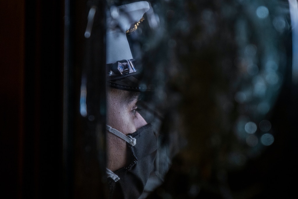 Marine sentries at doors that were damaged on January 6th incursion into the US Capitol during rehearsals for the inauguration of President Joe Biden.