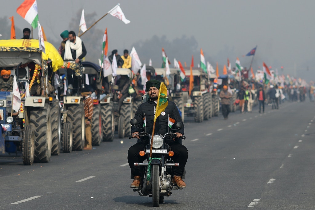 Farmers protest during a tractor rally near the Singhu border crossing in Delhi, India, on Tuesday, Jan. 26, 2021. Thousands of Indian farmers on tractors entered New Delhi as the country marked its Republic Day, escalating protests against new agricultural laws passed by Prime Minister Narendra Modi's government. Photographer: Anindito Mukherjee/Bloomberg via Getty Images